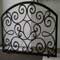 forged free standing fireplace screen painted with heat resistant paint