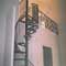 custom spiral stair with handforged center panel platform forged iron pickets with collars